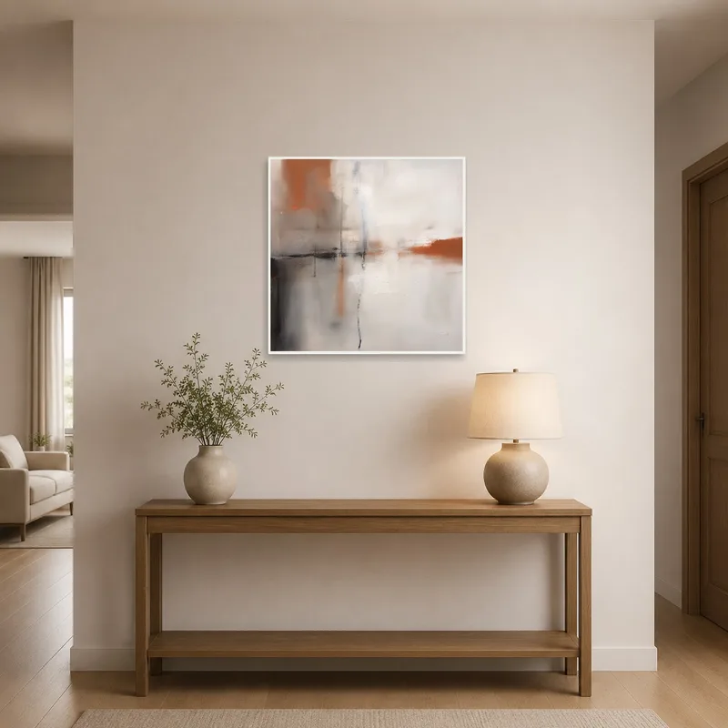 Artistic square piece in abstract earth tones graces the entrance hall.