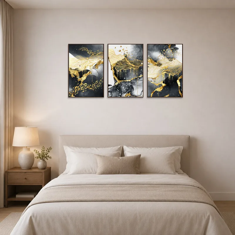 Triptych art complements the calming ambiance of a bedroom.