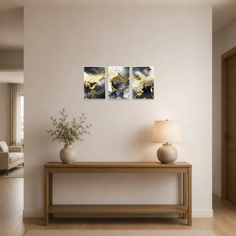 Gold and charcoal triptych adding elegance to an entrance hall.
