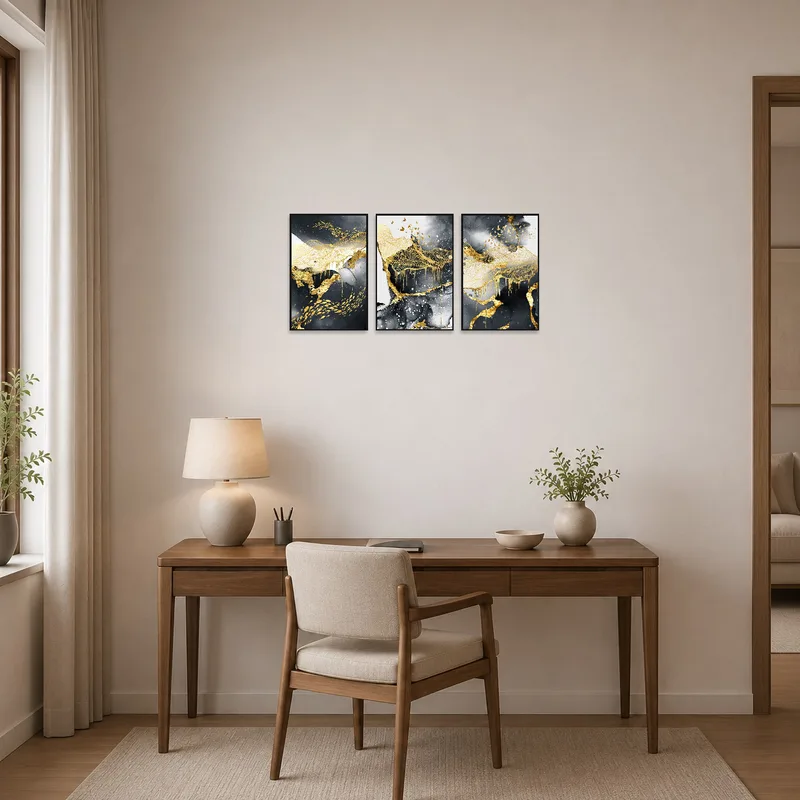 Gold and charcoal artwork elevates a functional home office.