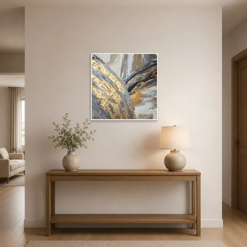 Abstract textured canvas in gold and gray adorns an entrance hall.