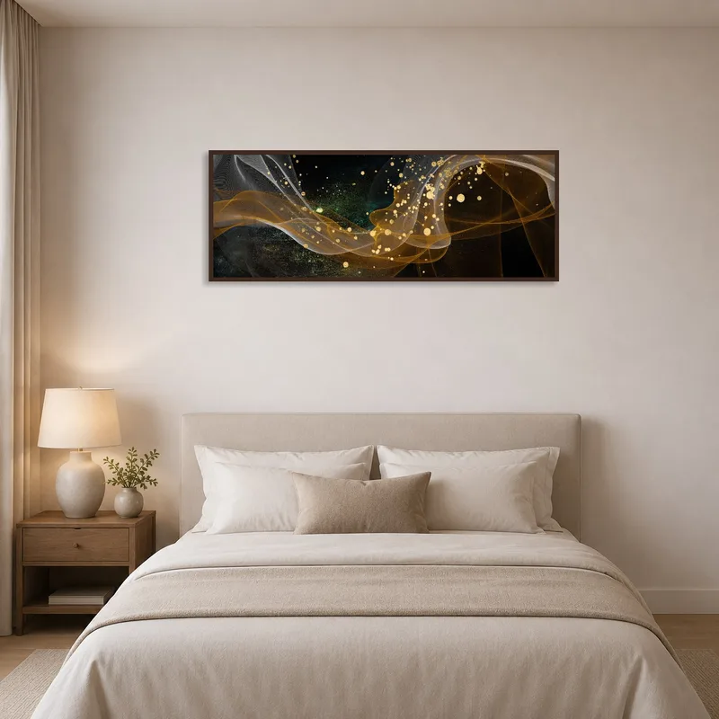 Abstract golden wave art print as a calming piece above a bed.