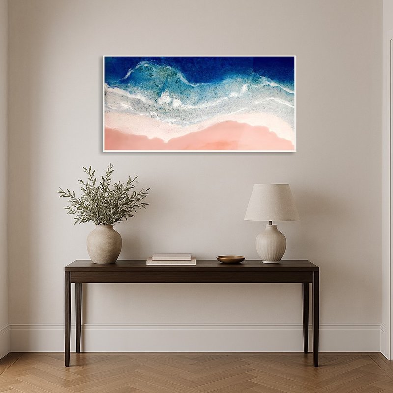 Ocean Art infuses the entrance hall with a coastal vibe above a console.