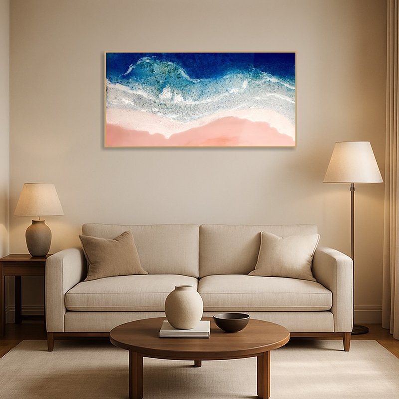 Aerial Coastal Ocean Art brightens a modern living room above a sleek sofa.