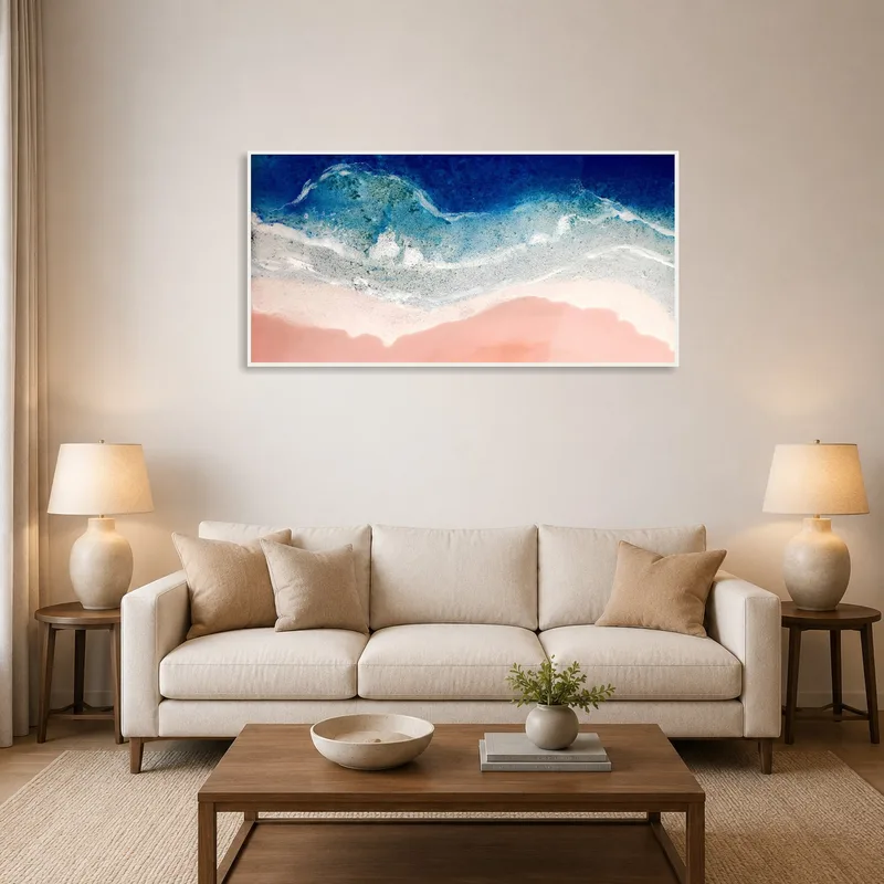Ocean waves art above a sofa in a cozy living room.