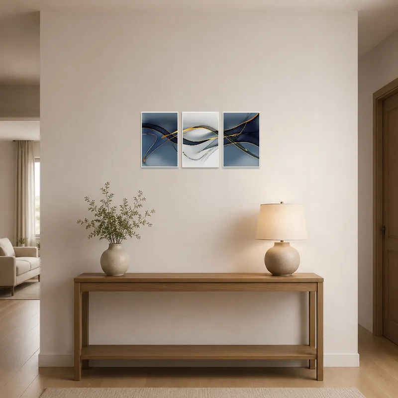Colorful abstract triptych with gold tones in a welcoming entrance hall.