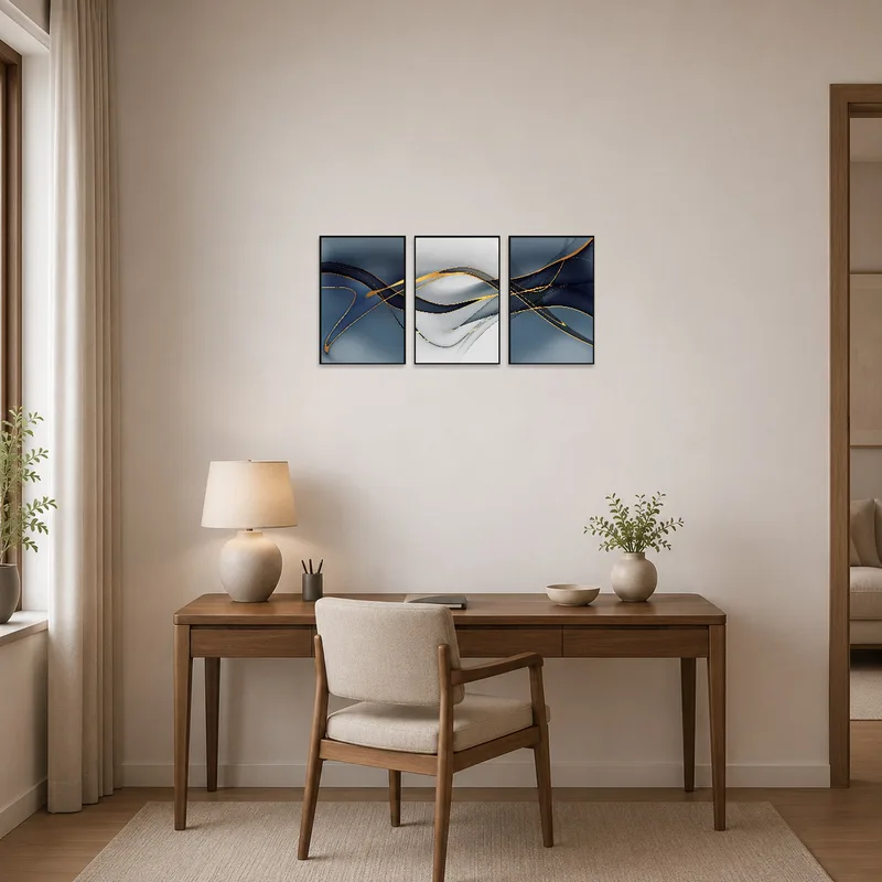 Abstract triptych with gold highlights adding sophistication to a home office.