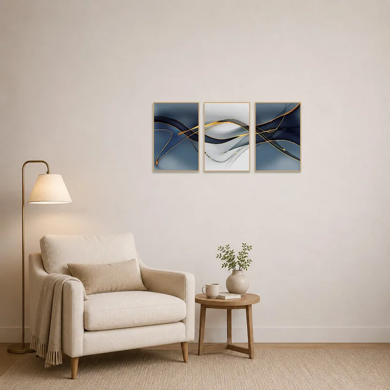 Abstract triptych with flowing gold accents enhancing a cozy reading corner.