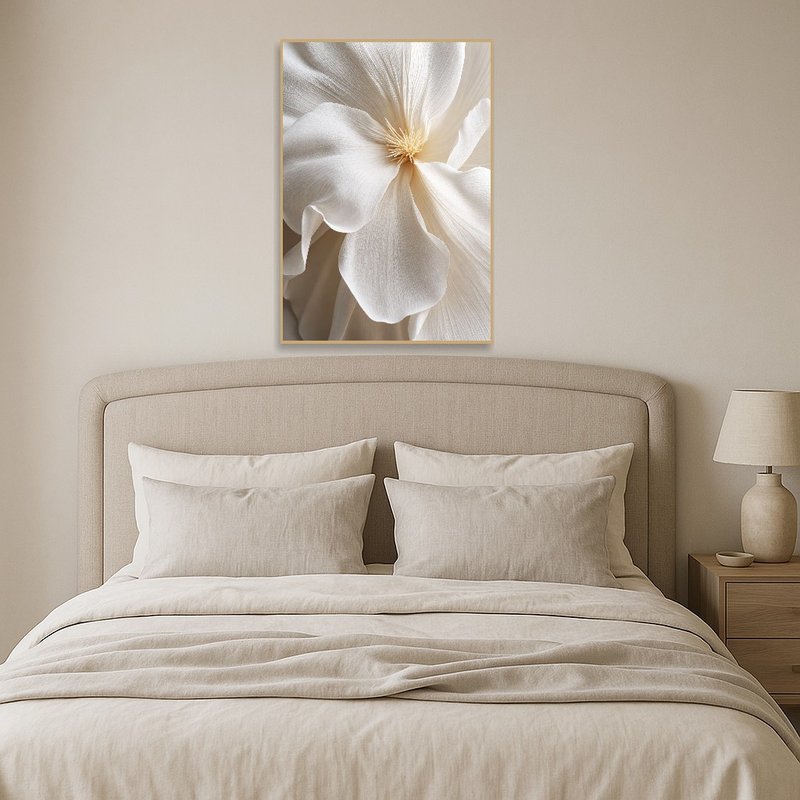 Floral piece in calming beige tones adding warmth above a bed.