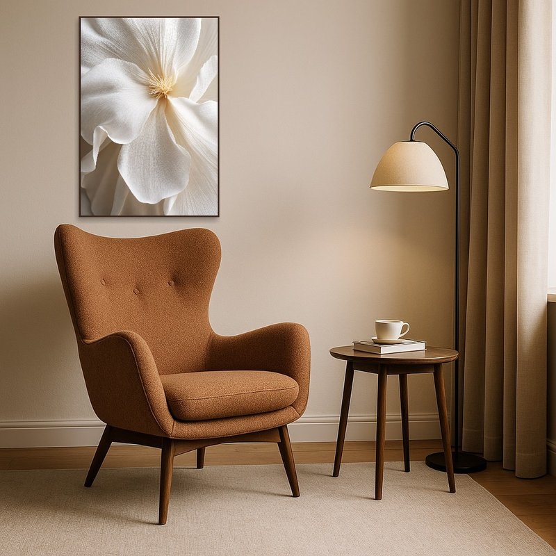 Elegant floral artwork beside a comfy armchair with a reading lamp.