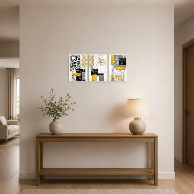 An entrance hall displaying an elegant gold and marble abstract triptych set.
