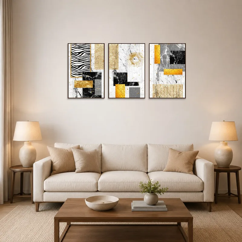 A modern living room with a stylish gold and marble abstract triptych on the wall.