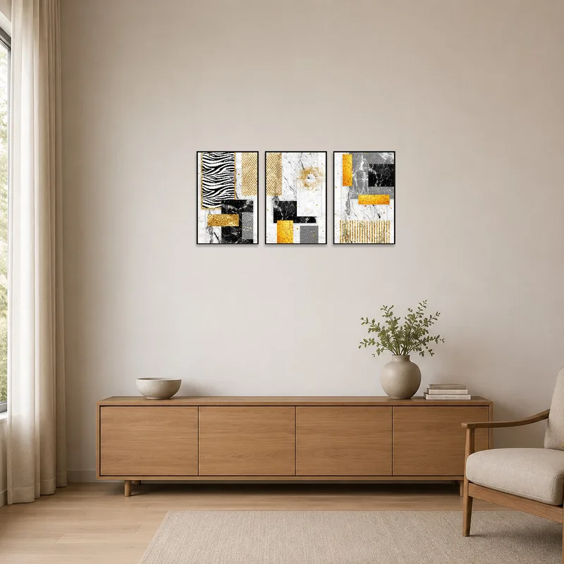 A minimalist space highlighting a gold and marble abstract triptych as a focal point.
