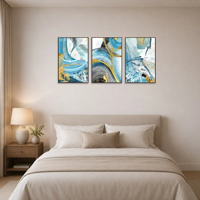 Triptych featuring gold accents creating a serene atmosphere in a modern bedroom setting.