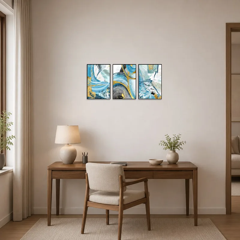 Abstract triptych with gold elements enhancing a sophisticated home office with a sleek desk.