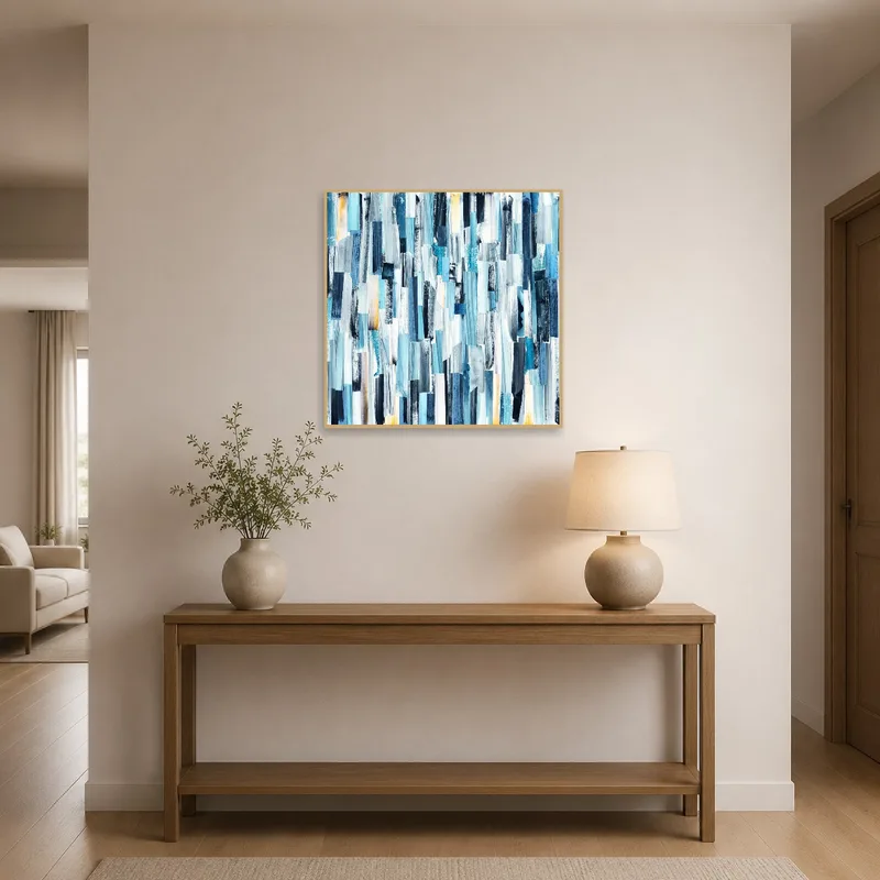 Blue abstract artwork in an entrance hall, creating a striking first impression beside a console table.