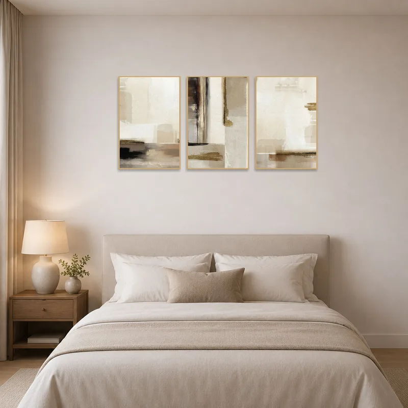 Earthy tones abstract triptych art set adorns a bedroom wall, adding warmth to the space.