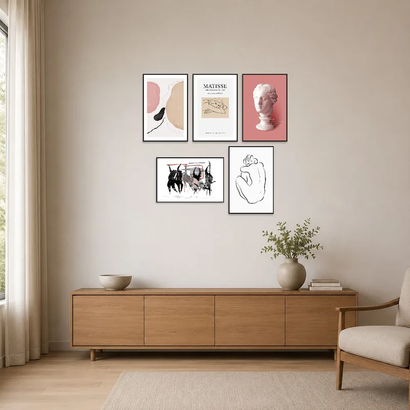 Sophisticated art prints set against a stark, minimal white wall and furniture arrangement.