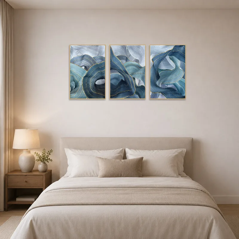 Abstract blue wave art print providing a soothing touch on the bedroom wall.