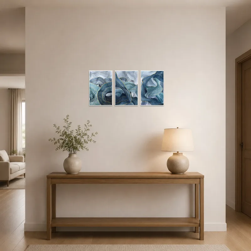 Blue wave triptych art warmly welcoming guests in an entrance hall.