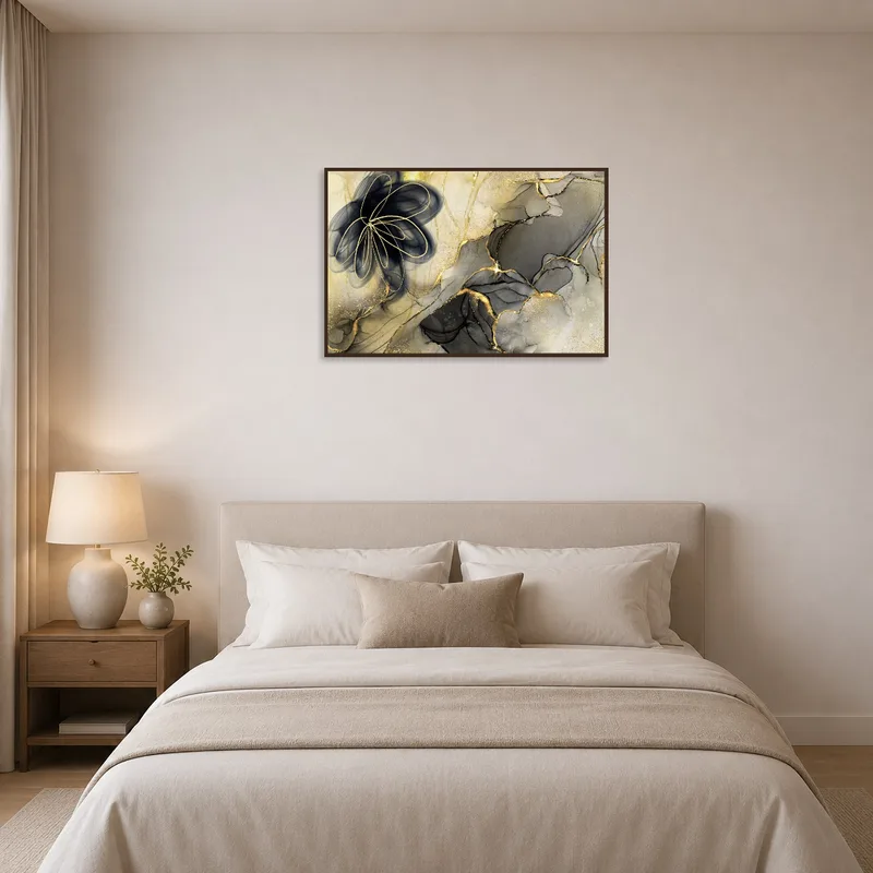 Bedroom exudes elegance with abstract floral art in gold and black tones.