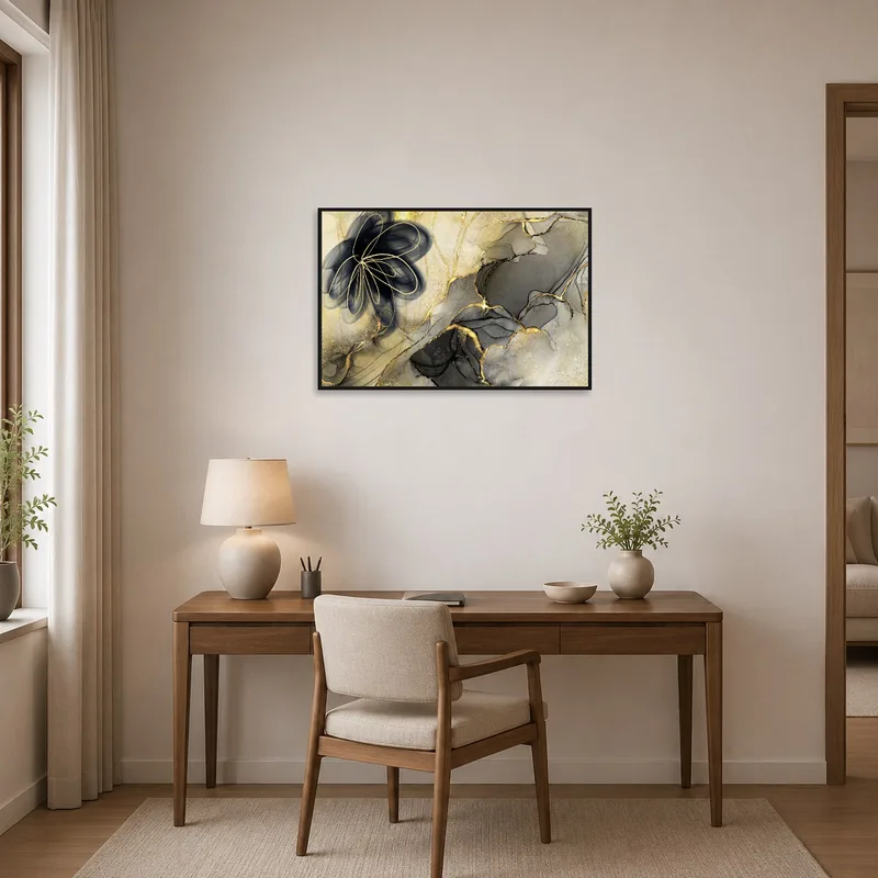 Home office with a classy boost from abstract floral art in gold and black hues.