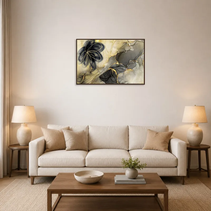 Elegant abstract floral art in gold and black adds sophistication to a living room setting.