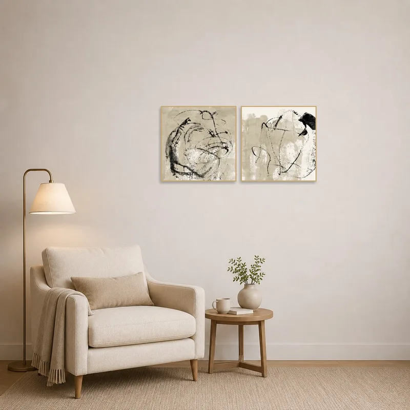Reading corner adorned with elegant abstract ink art set, accompanied by a comfy chair.
