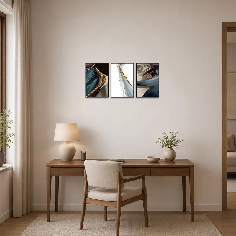 Stylish triptych with gold elements enhancing a home office ambiance.