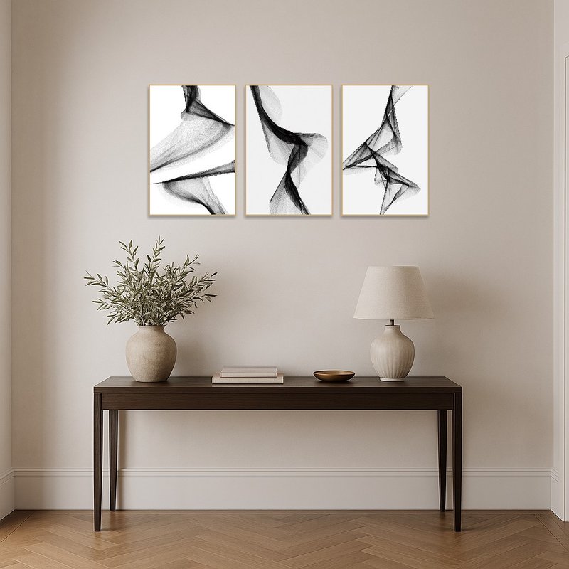Flowing monochrome triptych set greets guests in the entrance hall with artistic elegance.