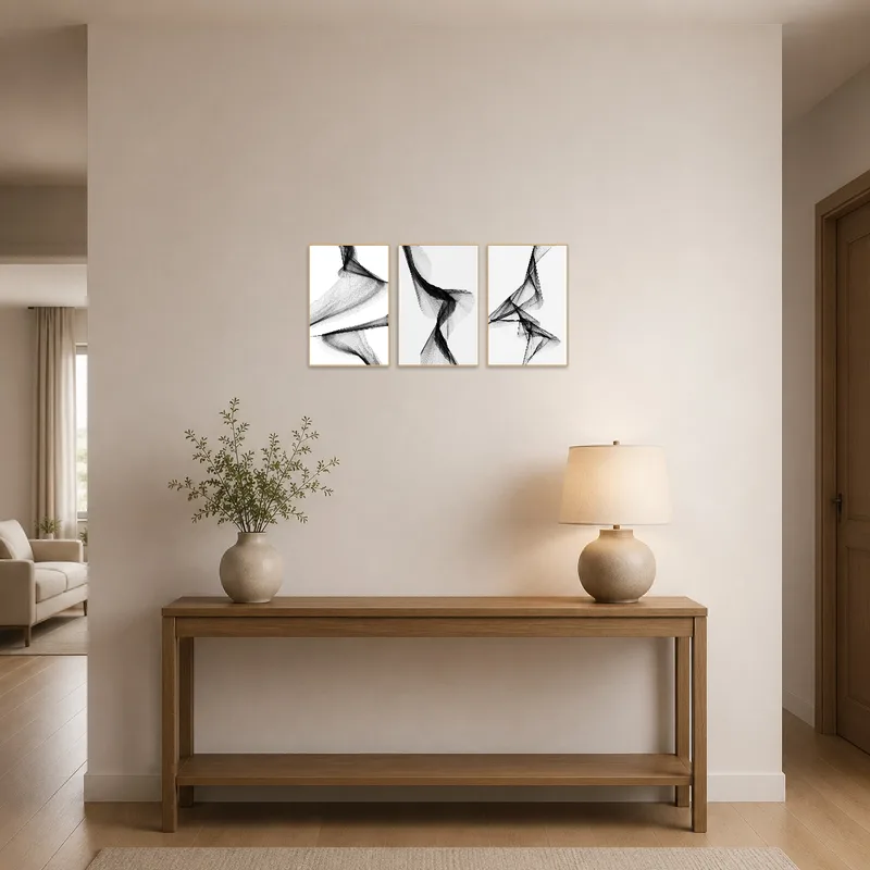 Triptych art featured in a sleek entrance hall.