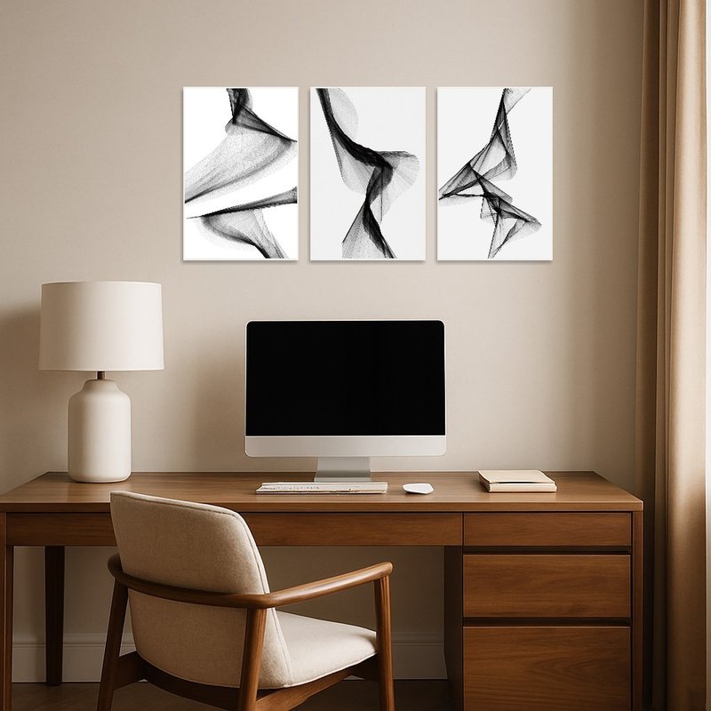Monochrome triptych set inspires creativity in a modern home office space.