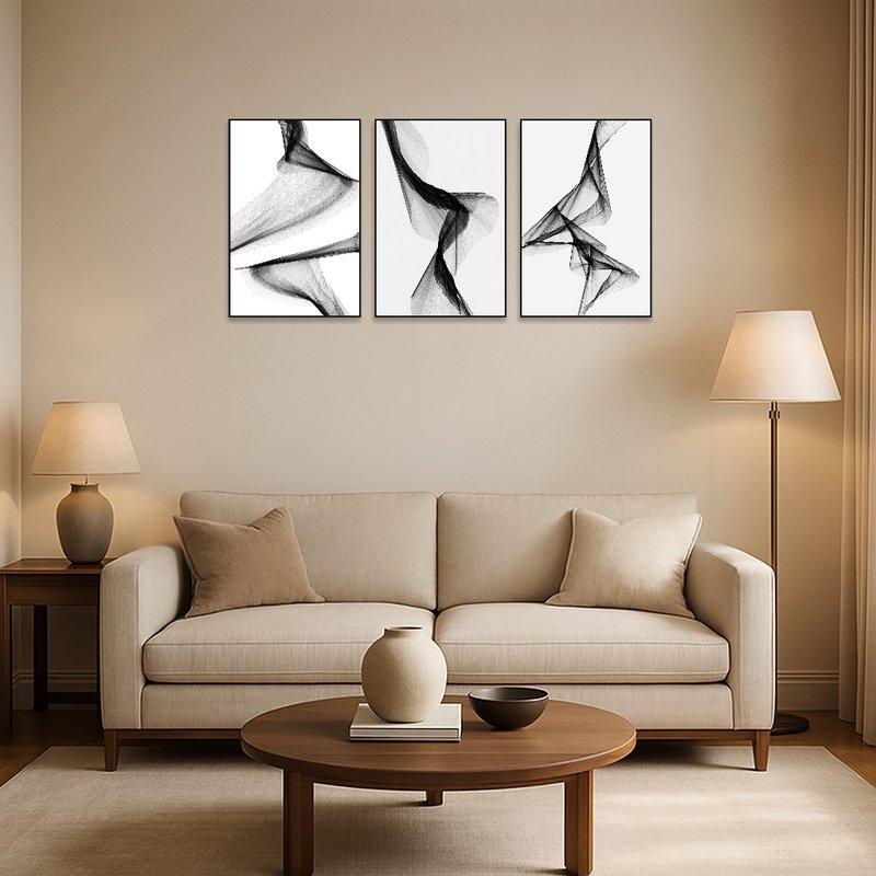 Triptych art set enhances a contemporary living room with its fluid monochrome design.