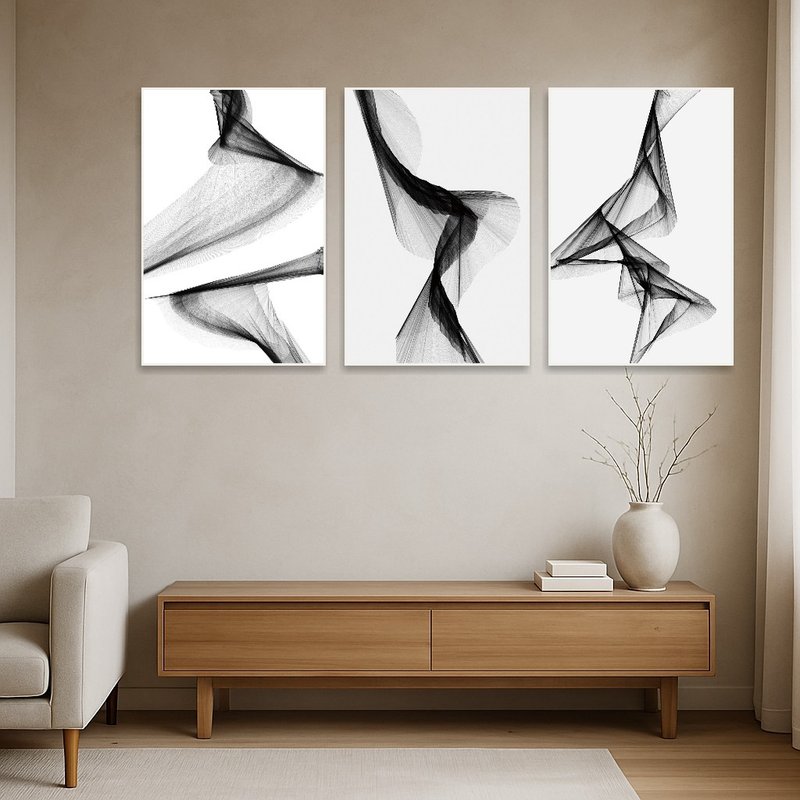 Abstract triptych set complements a minimalist room with its subtle flow and monochrome hues.