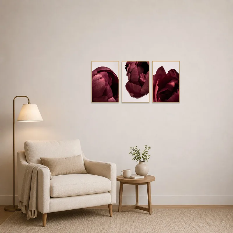 Deep red flower artwork set enhancing a cozy reading corner with a comfy chair.