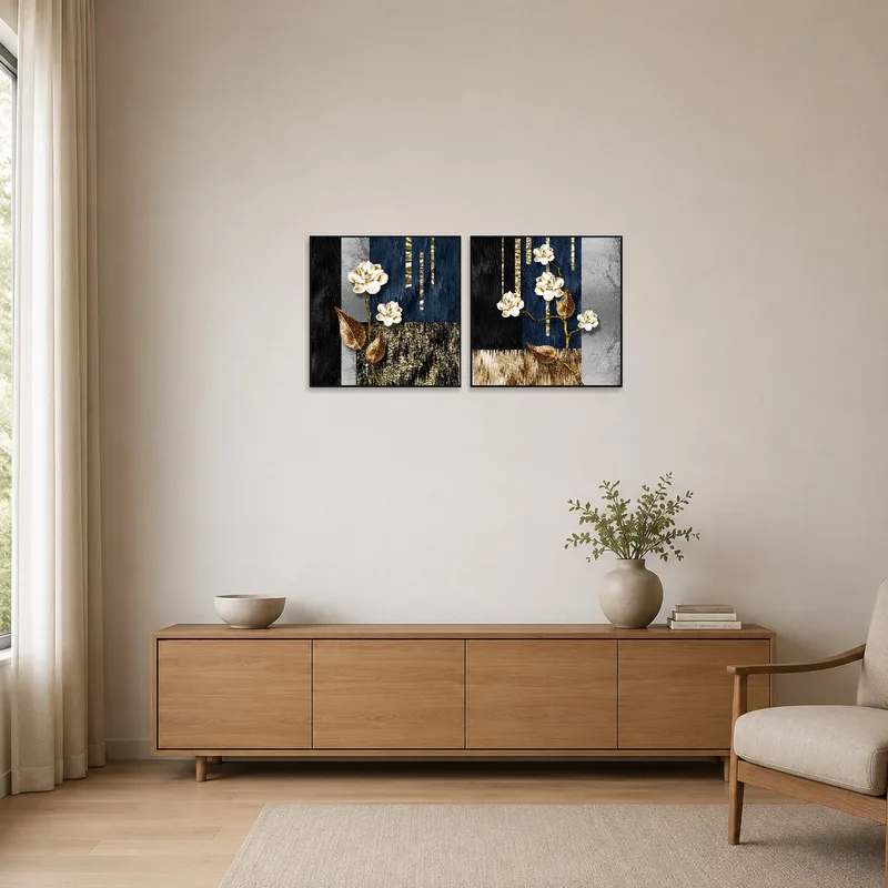 Minimalist space features elegant floral and abstract gold panels set on a crisp white wall.