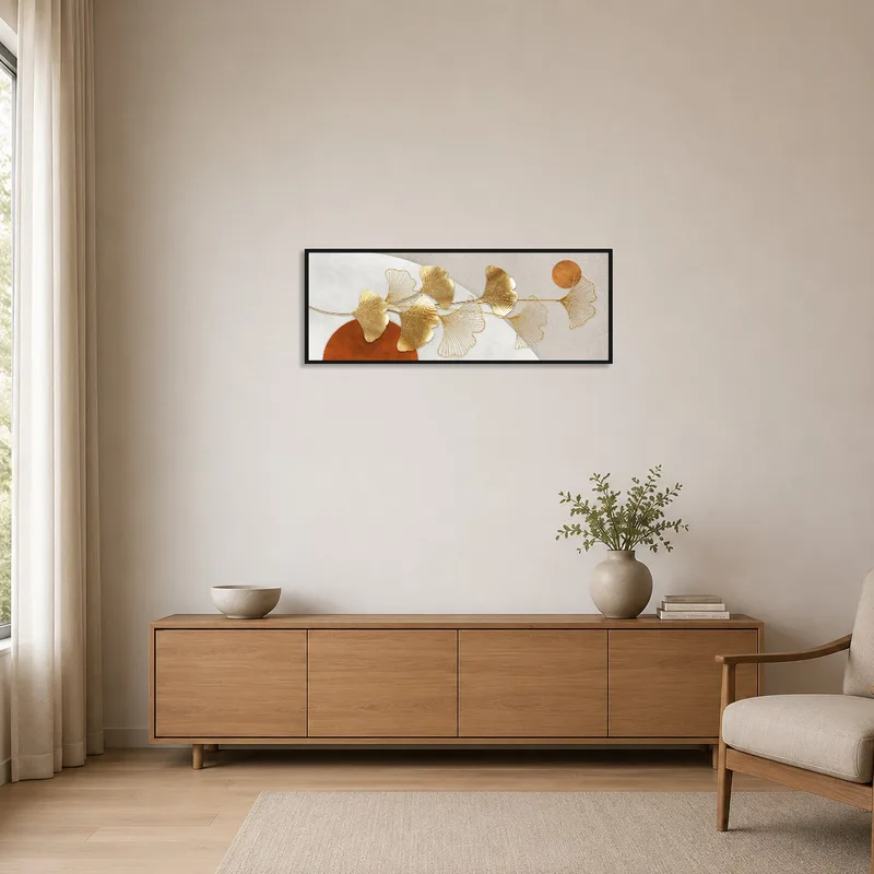 Ginkgo gold leaf print as a focal point in a minimalist white room.