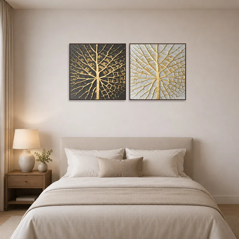 Gold leaf veins art adding sophistication to a serene bedroom wall.