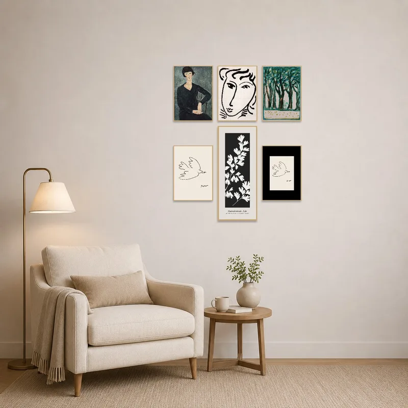 A portrait and nature set adds inspiration to a cozy reading corner beside an armchair.