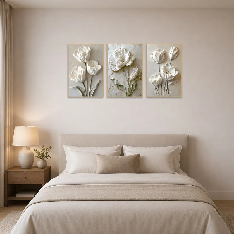 Bedroom with elegant white floral artworks creating a serene atmosphere.