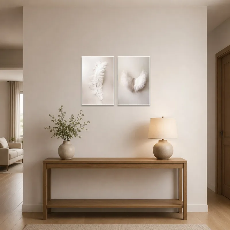 Ethereal feather art in soft hues enhances the welcoming vibe of the entrance hall.