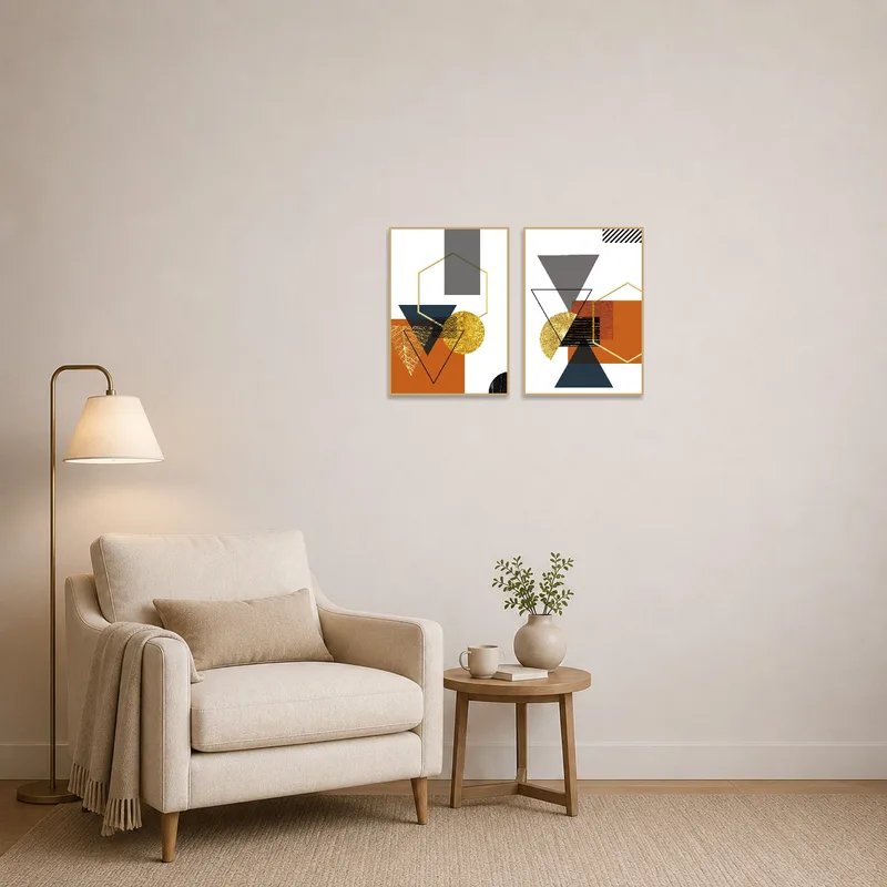 A cozy reading corner is enhanced by gold and earthy abstract art, bringing warmth to the space.