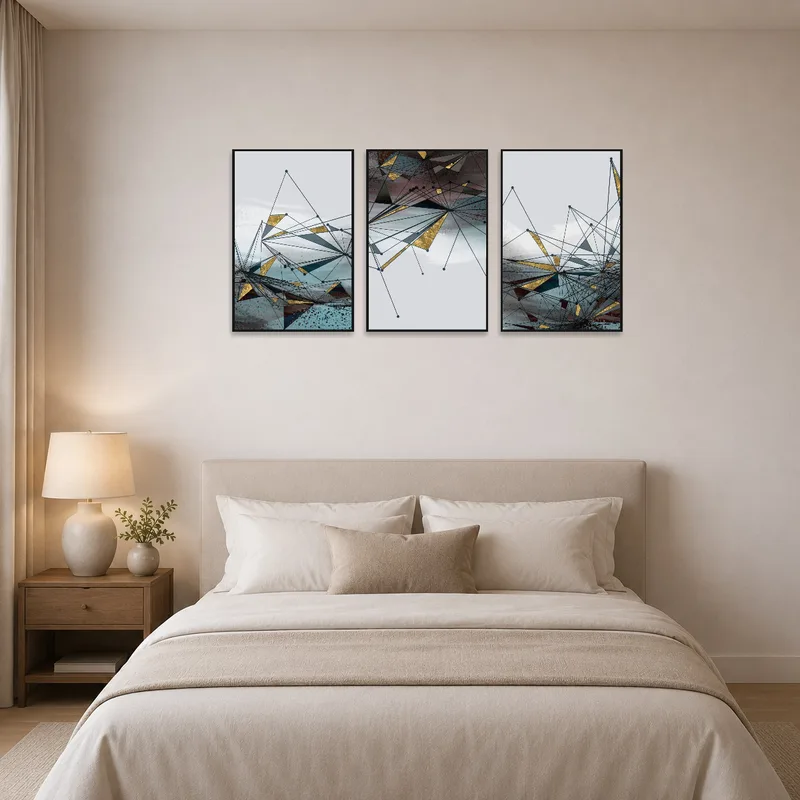 Geometric abstract triptych with gold accents enhancing a serene bedroom ambiance.