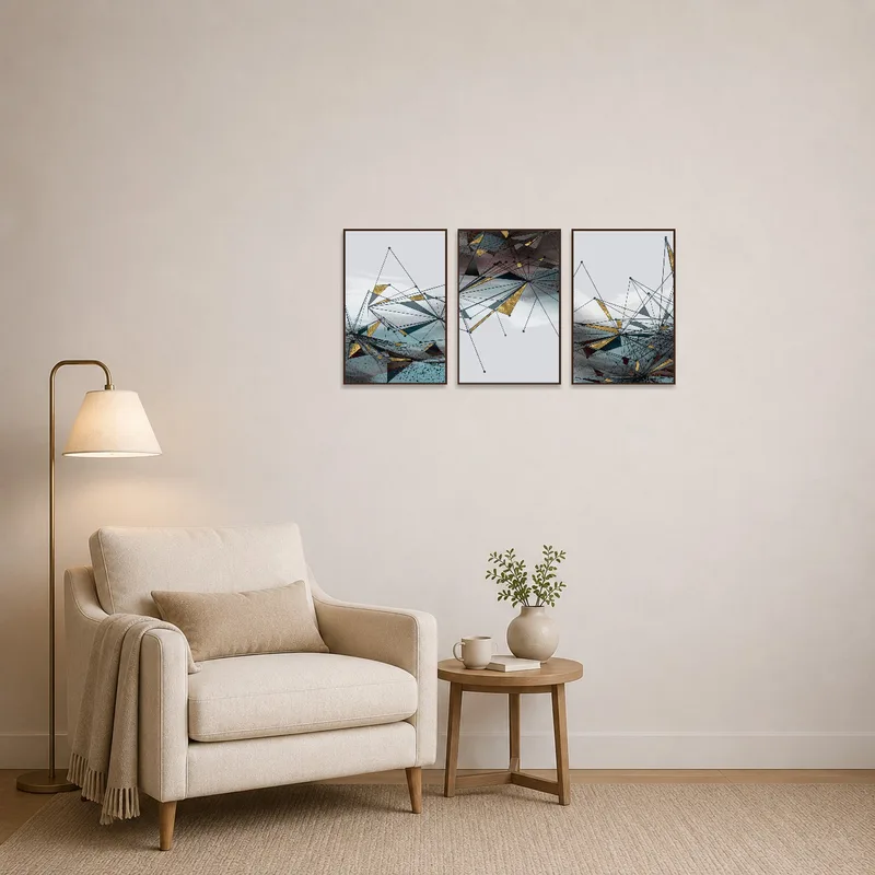 Geometric abstract triptych with gold accents adding interest to a cozy reading corner.