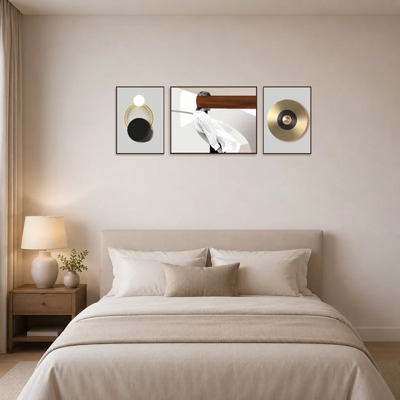 Bedroom wall adorned with a geometric and abstract triptych set above the headboard.