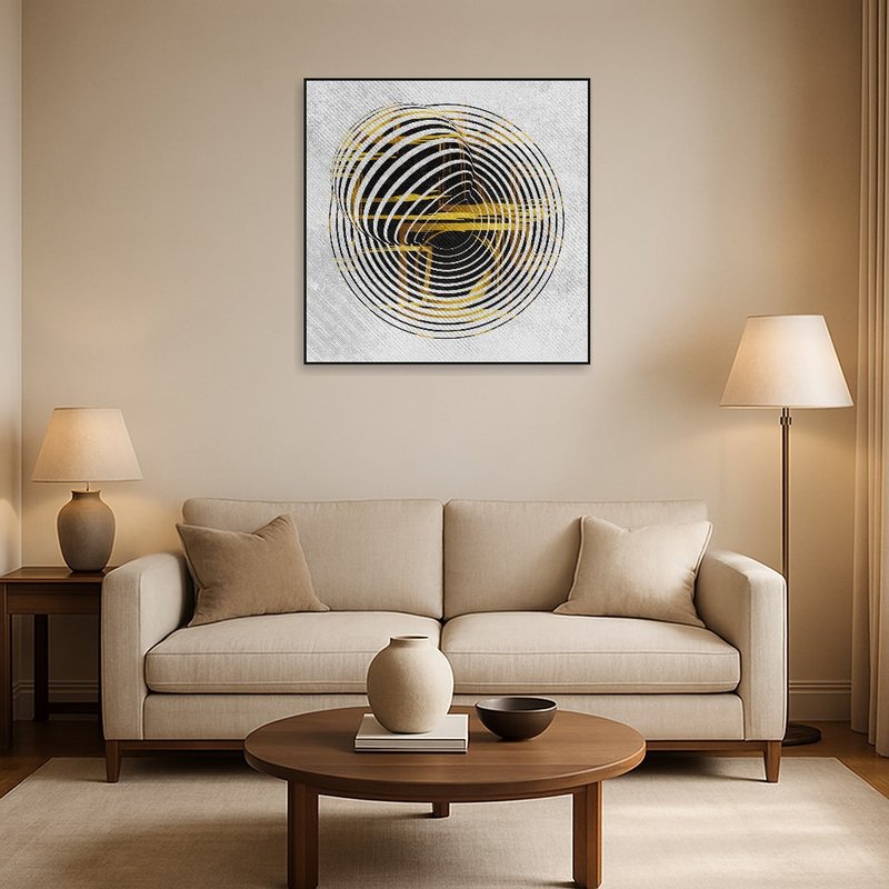 Black and yellow circular art on living room wall above a modern sofa.