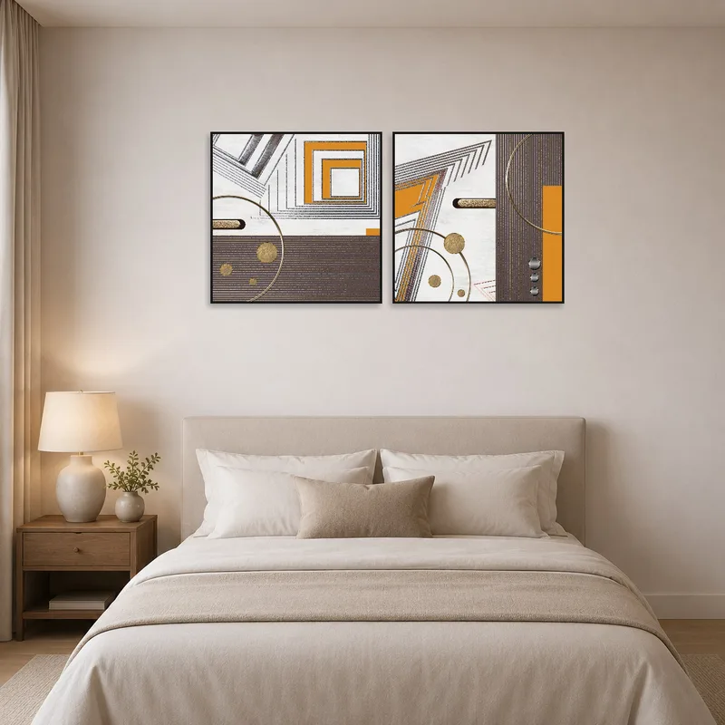 Elegant square art pieces create a focal point above a bed in a stylish bedroom.