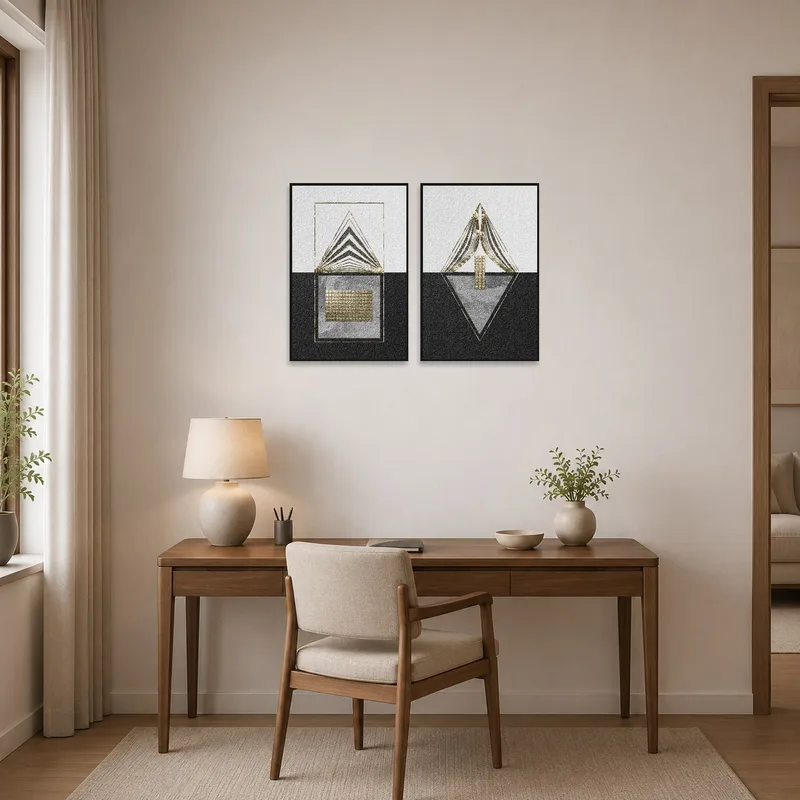Gold and black geometric art set enhances a home office space with light wood furnishings.