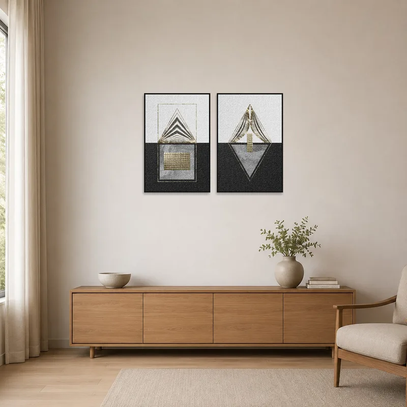 Gold and black geometric textured art set adds contrast in a minimalist room with white walls.
