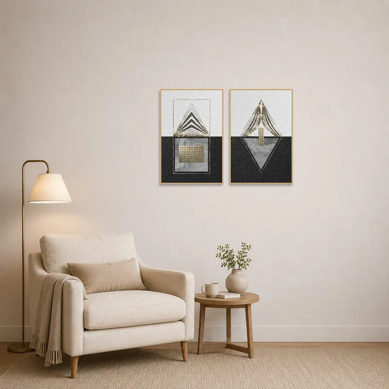 Geometric art set in gold and black mounted on a wall in a cozy reading corner with a plush chair.